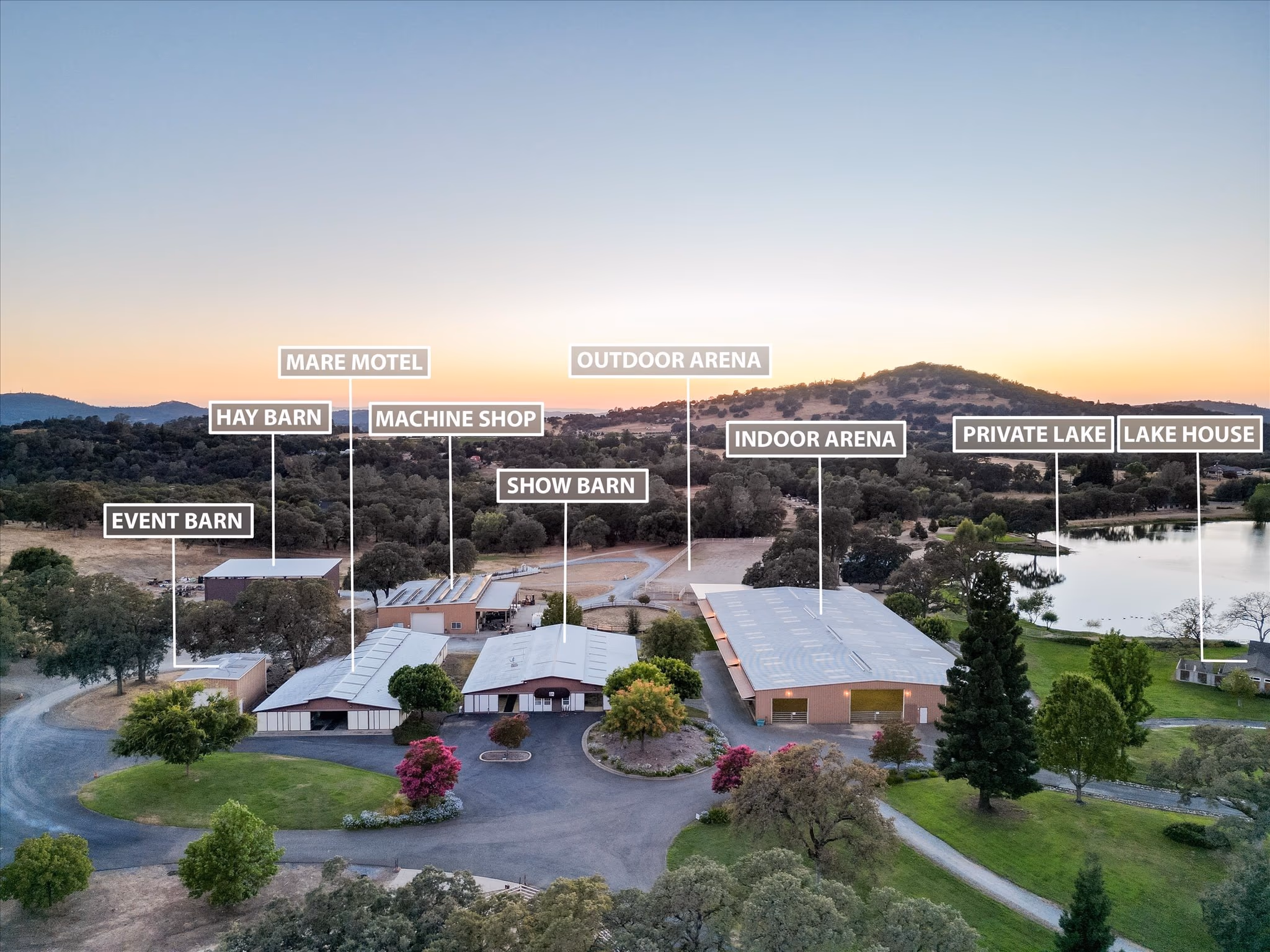 Annotated aerial of the Saureel Vineyards ranch complex, with labels marking the mare motel, hay barn, machine shop, show barn, covered arena, outdoor arena, event barn, private lake and lake house.